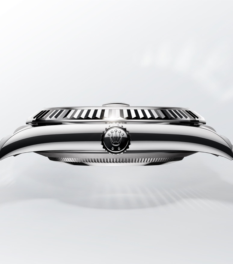 Silver colored rolex watch